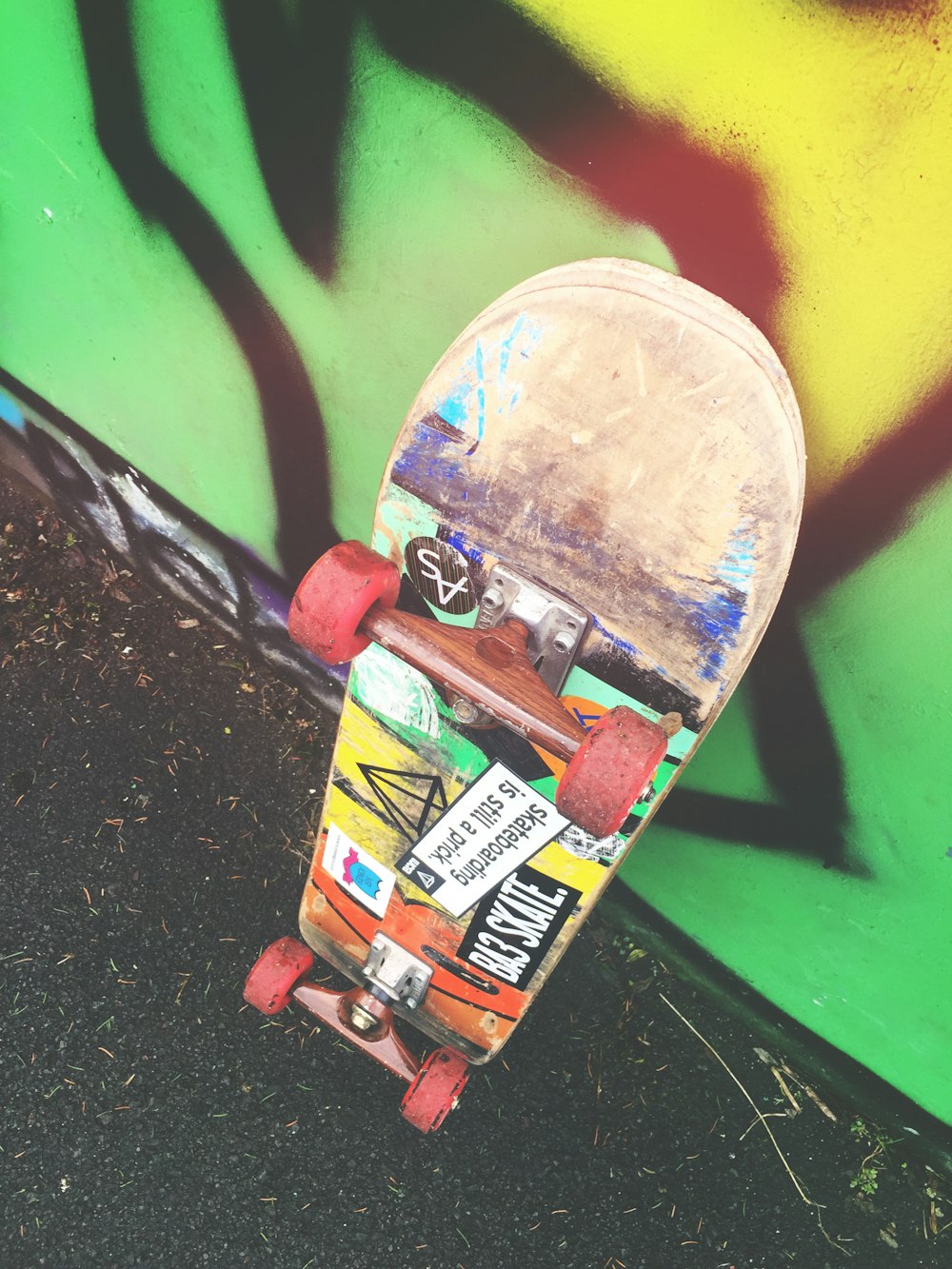skateboard on graffiti wall