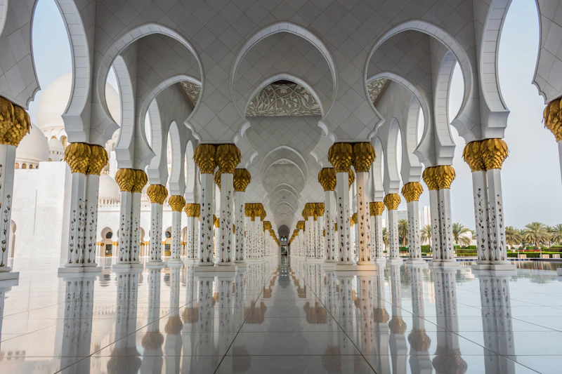 Symmetrical white colonnade at Sheikh Zayed Grand Mosque