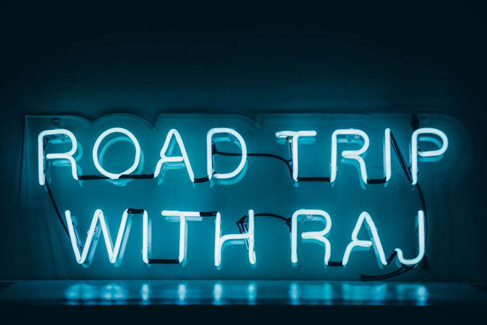 white Road Trip With Raj LED signage