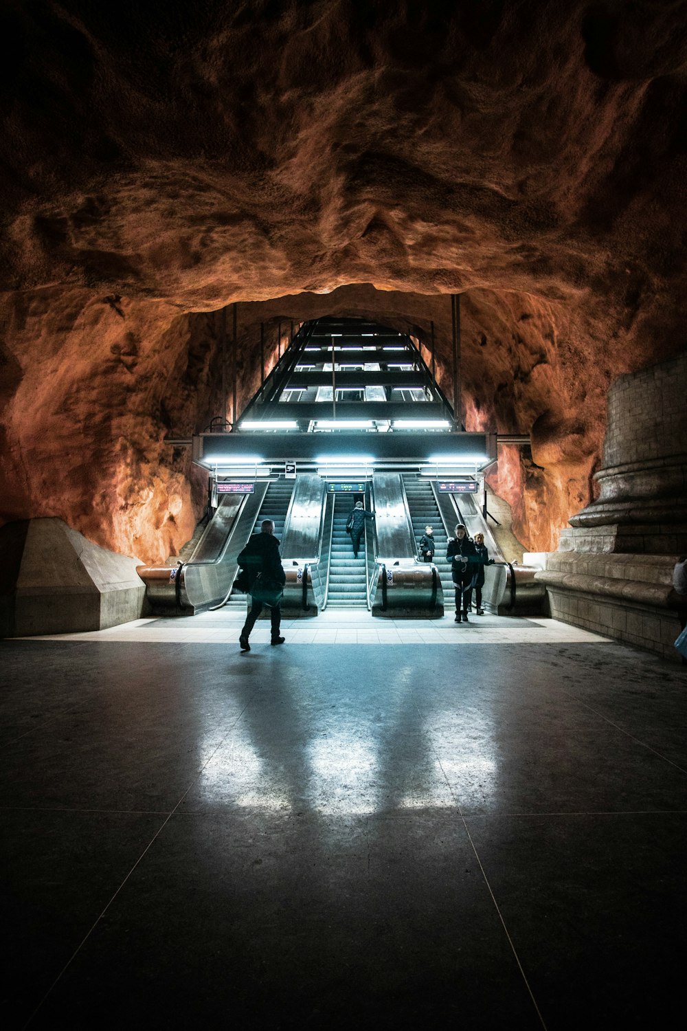 group of people crossing on underground elevator