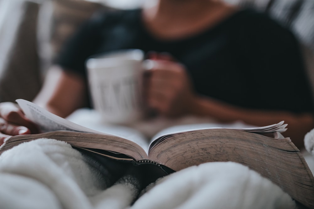 person holding coffee mug