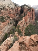 Tourists hiking a scenic trail along the edge of the Copper Canyon