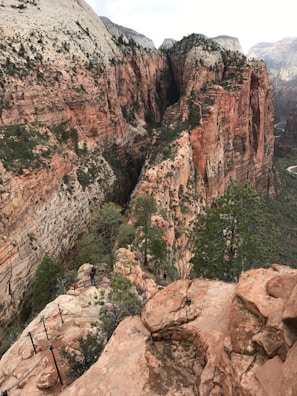 Tourists hiking a scenic trail along the edge of the Copper Canyon