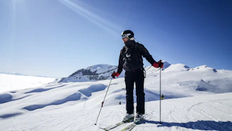 man skiing under clear blue sky