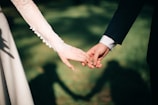 man and woman holding hands focus photo