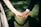 man and woman holding hands focus photo