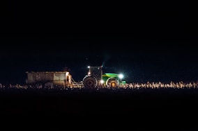 green freight truck on land during night