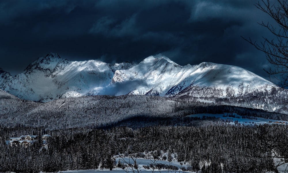 snow covered mountain taken at daytime