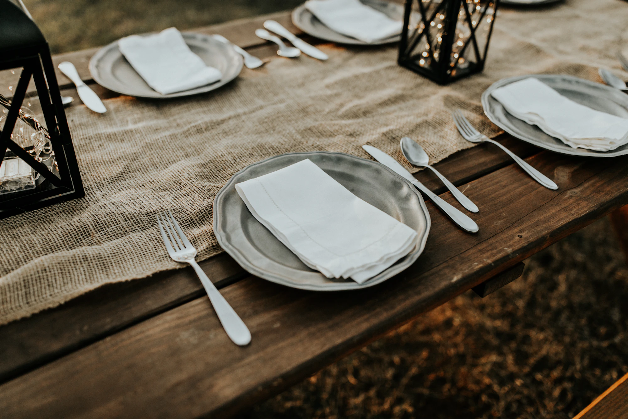 Neutral-toned ceramic tableware arranged on a linen table setting
