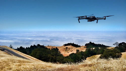 Professional drone flying over landscape — aerial photography for commercial property marketing