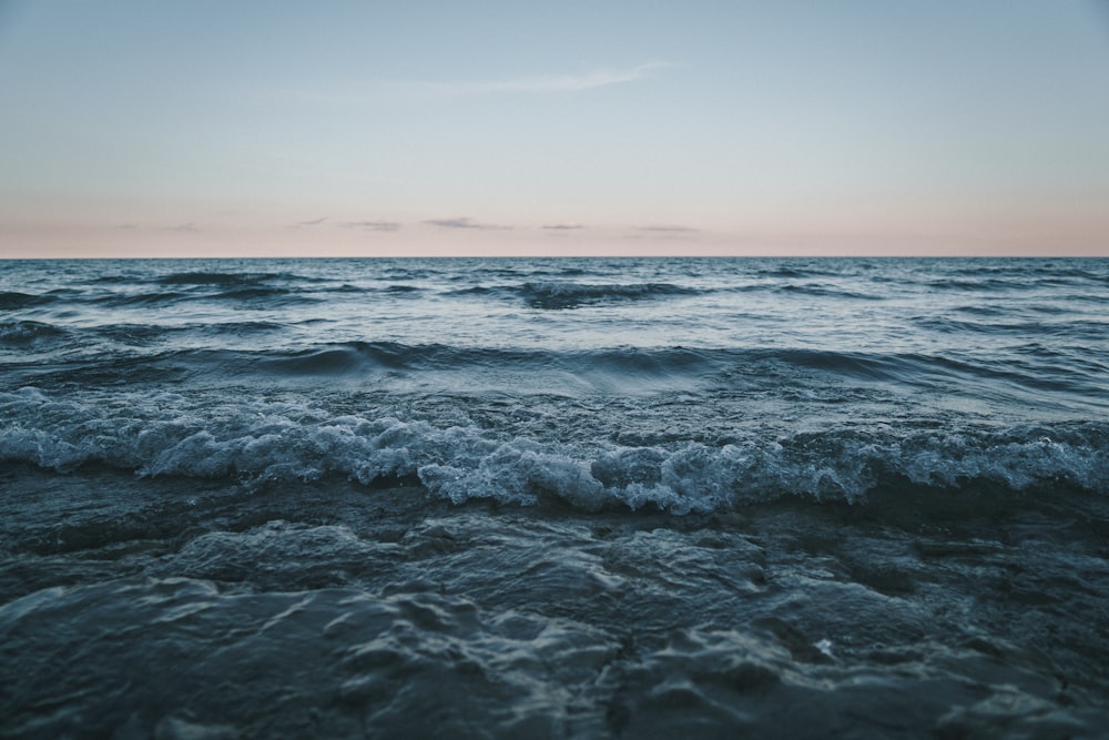 photo of ocean waves during daytime