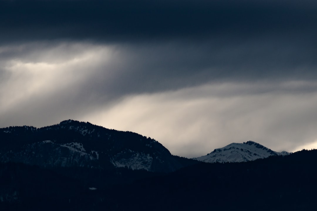 landscape photography of mountain under cloudy sky during daytime