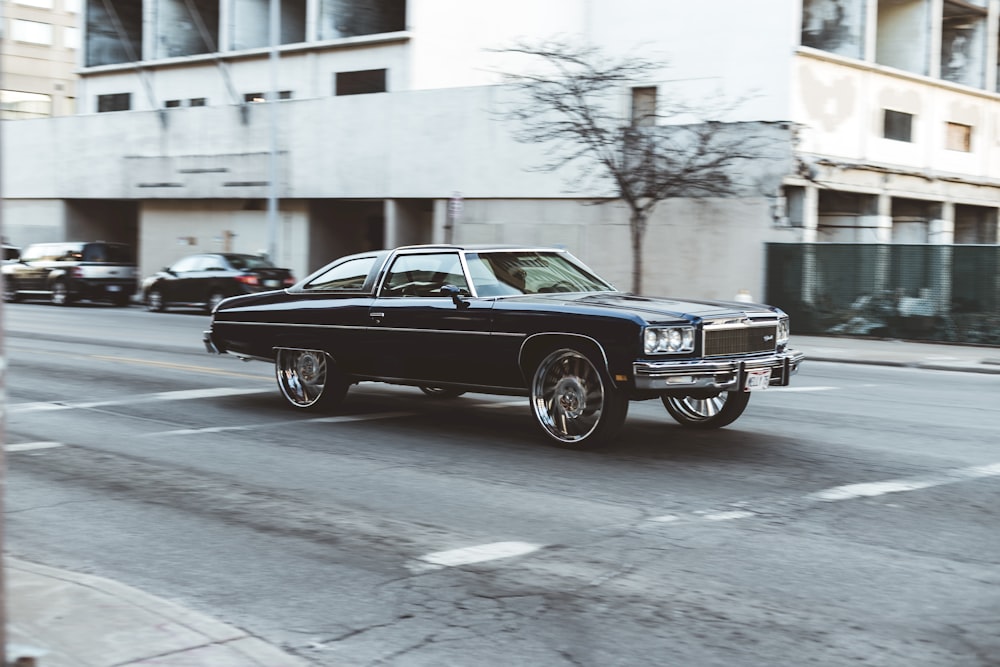 shallow focus photography of black coupe