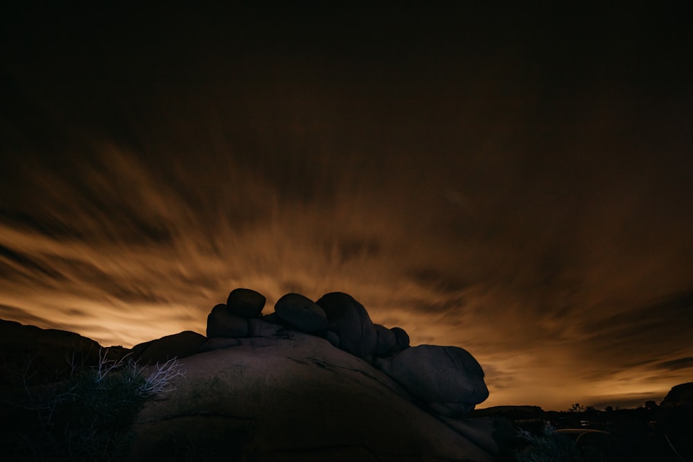 gray rocks under sunset