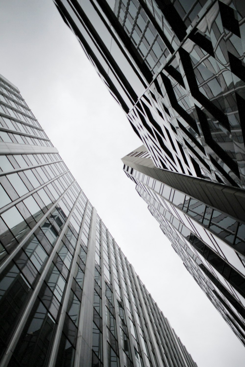 low angle photography of curtain wall glass buildings