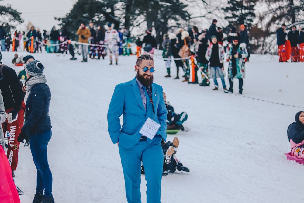 man walking on snow during daytime