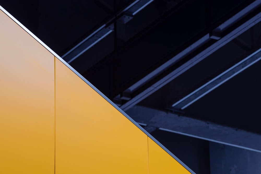 a close up of a yellow and black wall