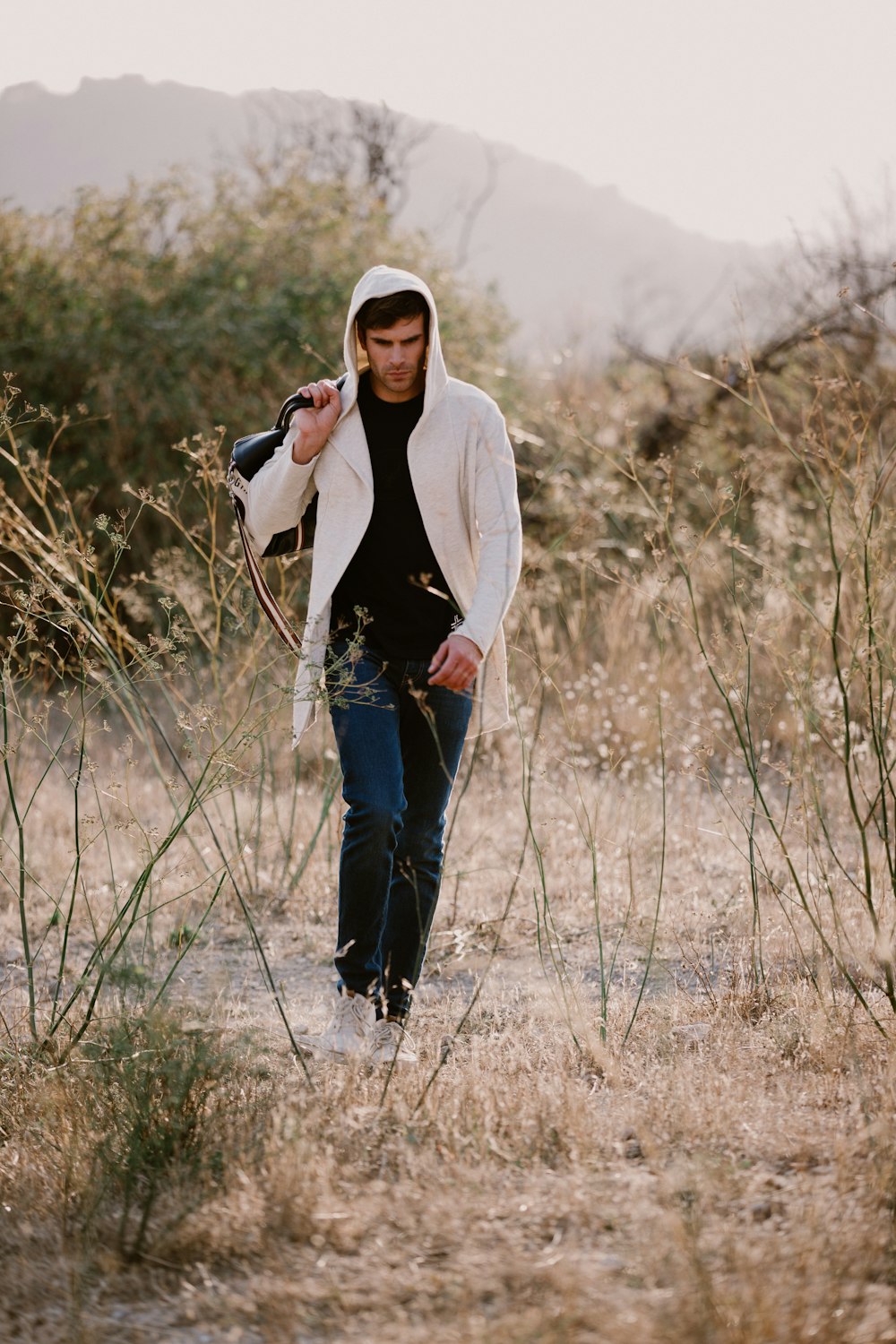 man walking on field