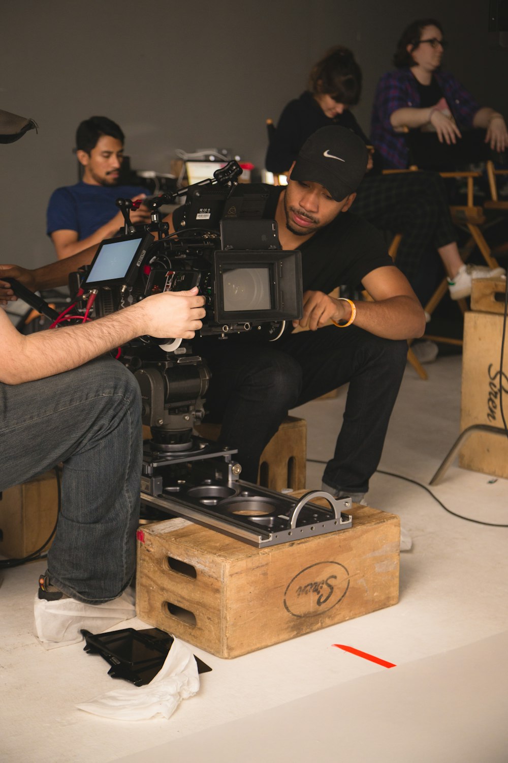 two men setting up camera inside room