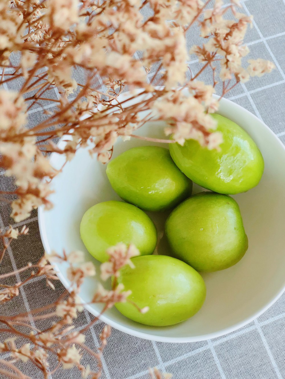 five limes in bowl