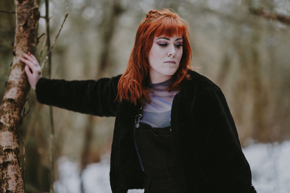 woman leaning on wood