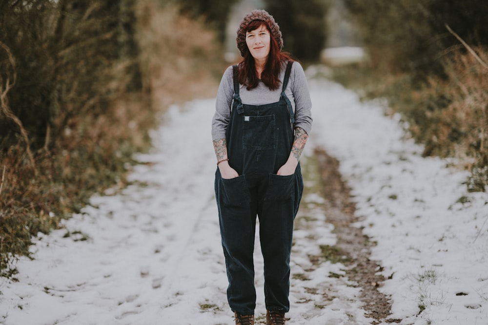 shallow focus photo of woman walking on snow