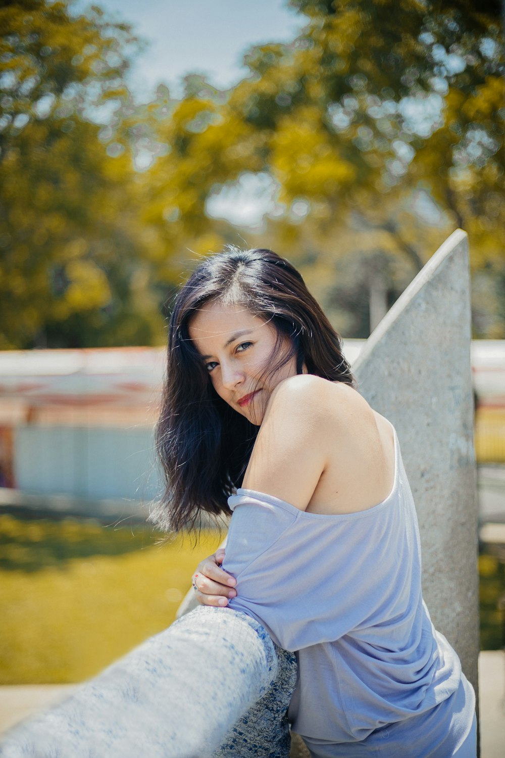 woman leaning on terrace in selective focus photography