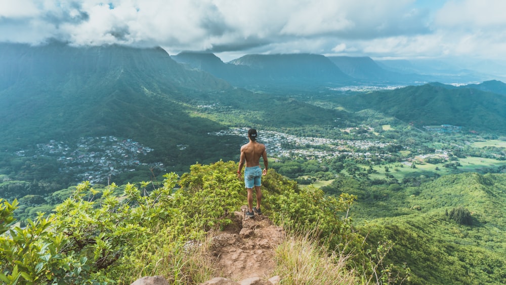 person on top of mountain during daytime