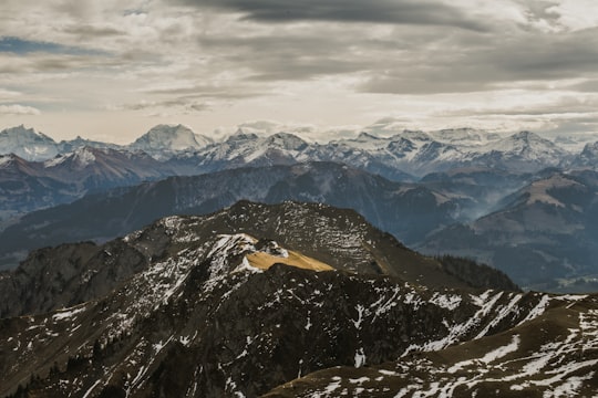aerial photography of mountains under cloudy sky in Gurnigel Pass Switzerland