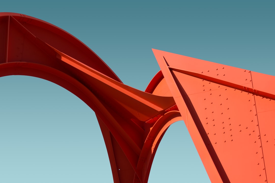 a red sculpture with a blue sky in the background, Big Red