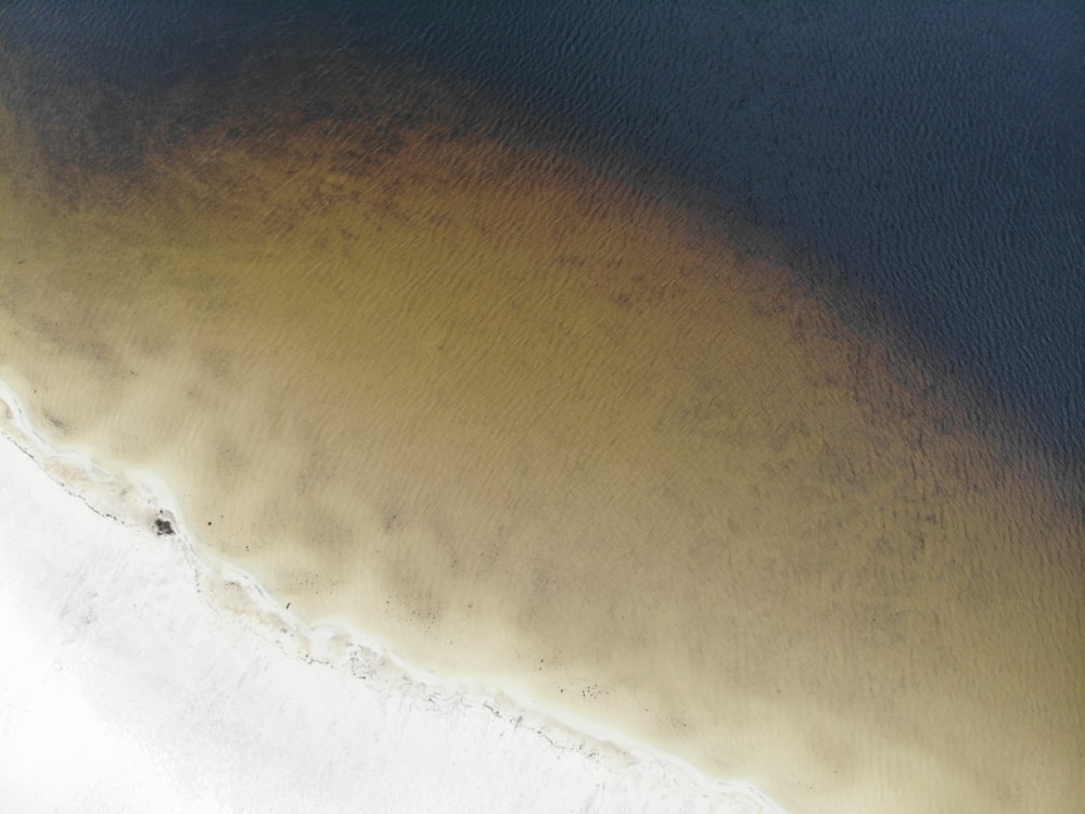 a bird's eye view of a sandy beach