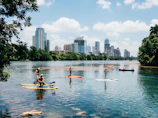 people riding paddle boards on the lake