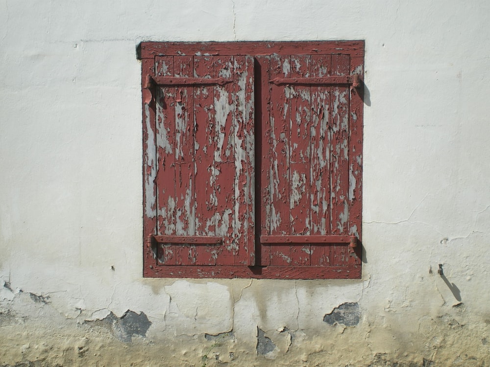 two brown wooden window in concrete