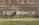 girl standing near brown building during daytime