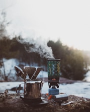 shallow focus photography of silver portable stove during daytime