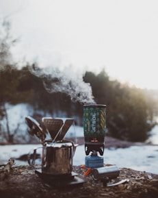 shallow focus photography of silver portable stove during daytime