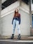 woman standing on sidewalk during daytime