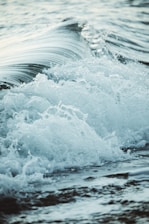 close up photography sea waves splashing on shore