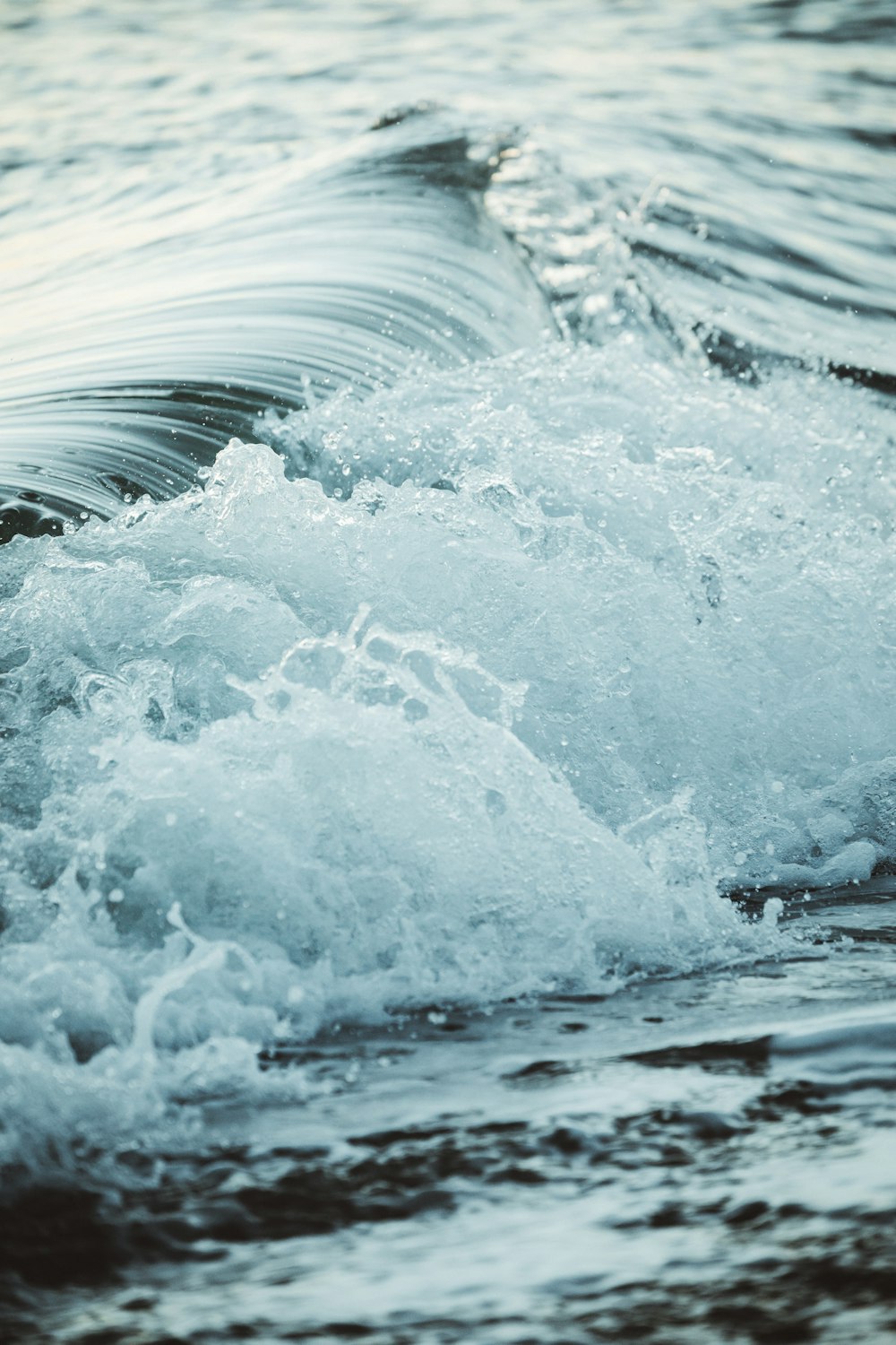 close up photography sea waves splashing on shore