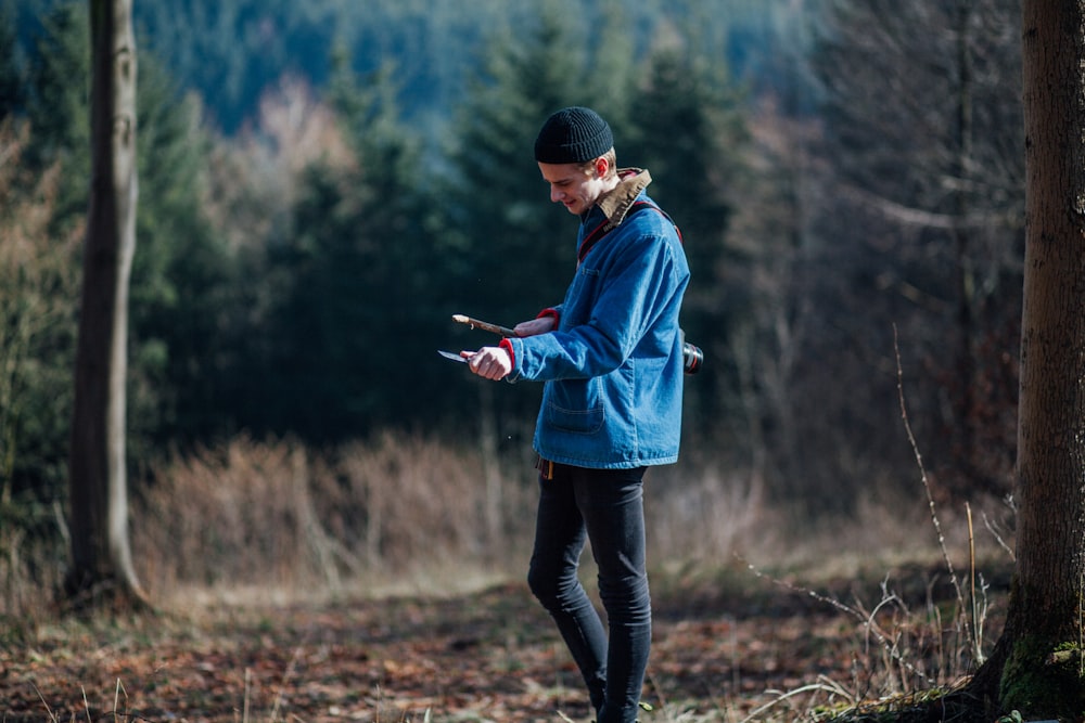 man standing near trees