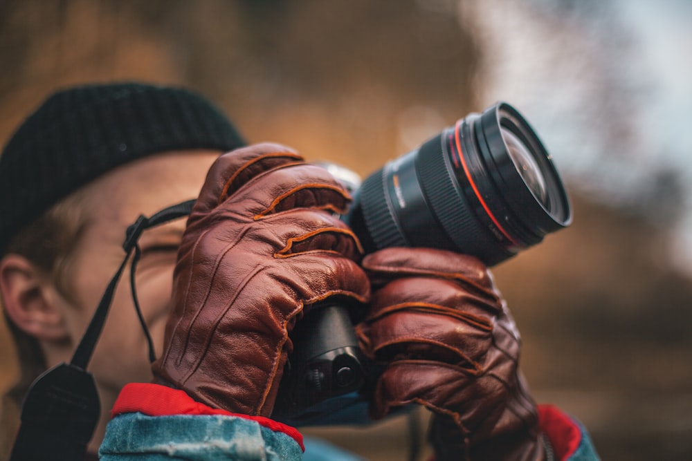 man taking picture using DSLR camera