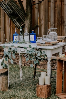 white wooden table with bottles on top