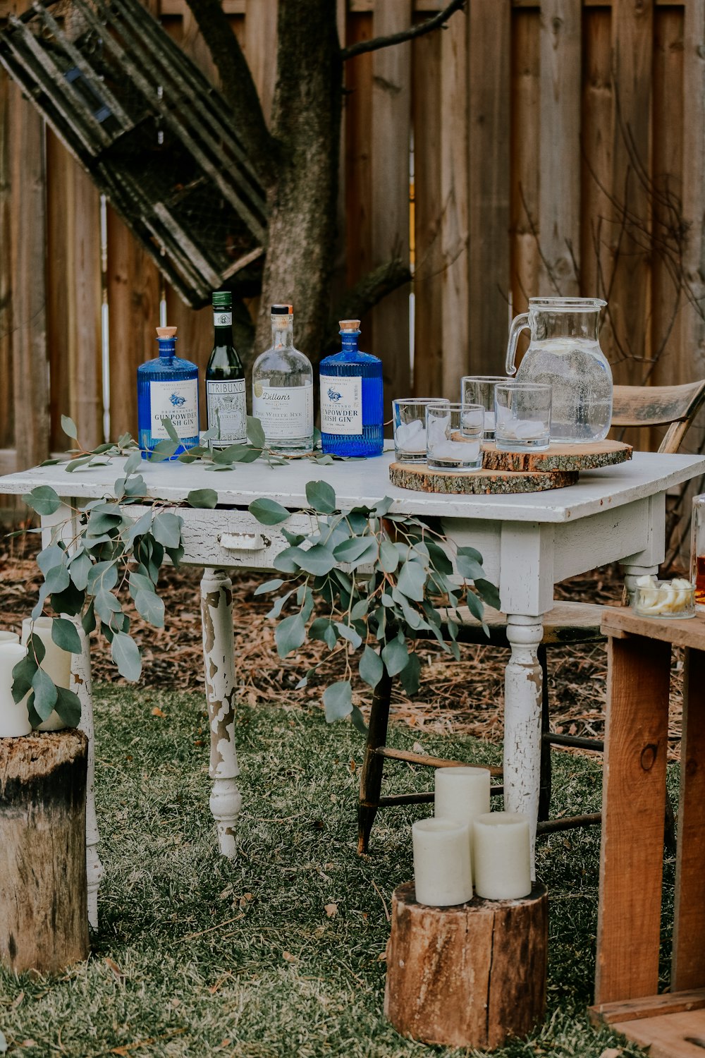 white wooden table with bottles on top