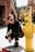 person posing beside fire hydrant