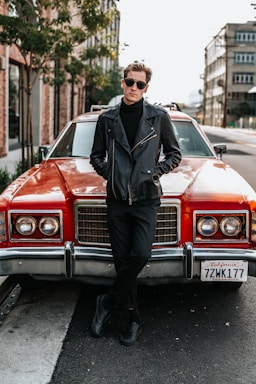 photography poses for men,how to photograph man leaning on red muscle car in street