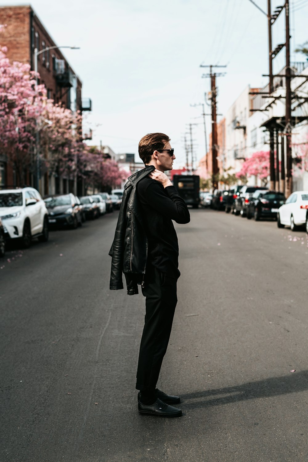 man standing in middle of road