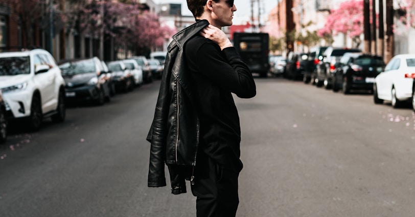 man standing in middle of road