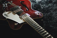 white and red electric guitar