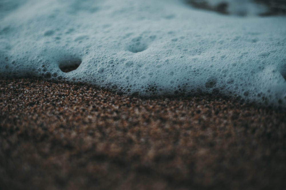 white bubbles on brown soil