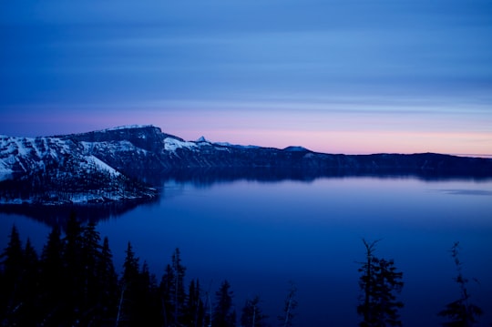 mountain near body of water over the horizon in Crater Lake United States